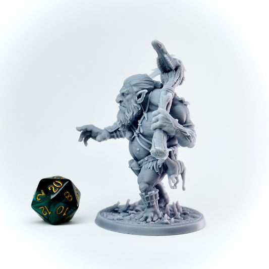 Gray fantasy troll figurine with a weapon on a white background