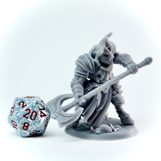 Gray fantasy figurine with a large axe next to a D20 dice on a white background