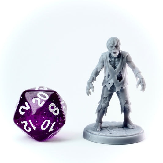 Zombie figurine with a purple dice on a white background