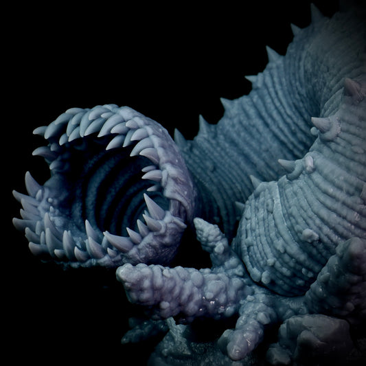 Close-up of a textured, purple worm creature with a dark background