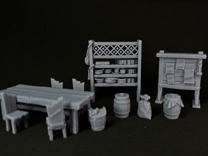 Set of miniature furniture and props on a black background