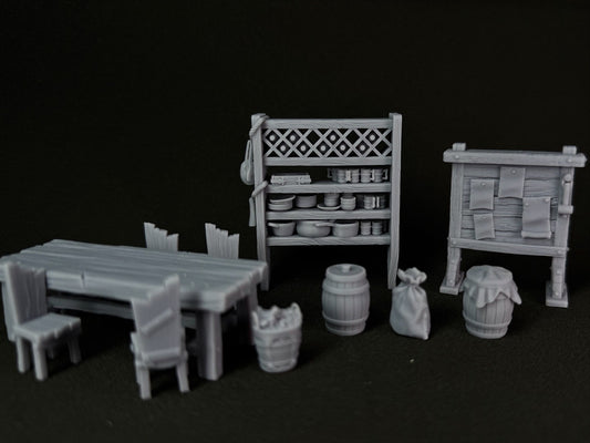 Set of miniature furniture and props on a black background