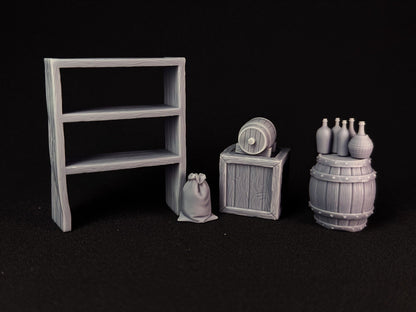 Set of miniature wooden furniture and props on a black background