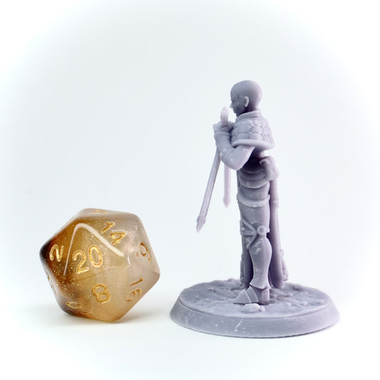 Gray figurine of a warrior with a spear next to a large polyhedral dice on a white background