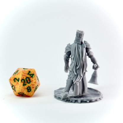 Gray miniature figure of a warrior with a large candle snuffer next to a d20 dice on a white background