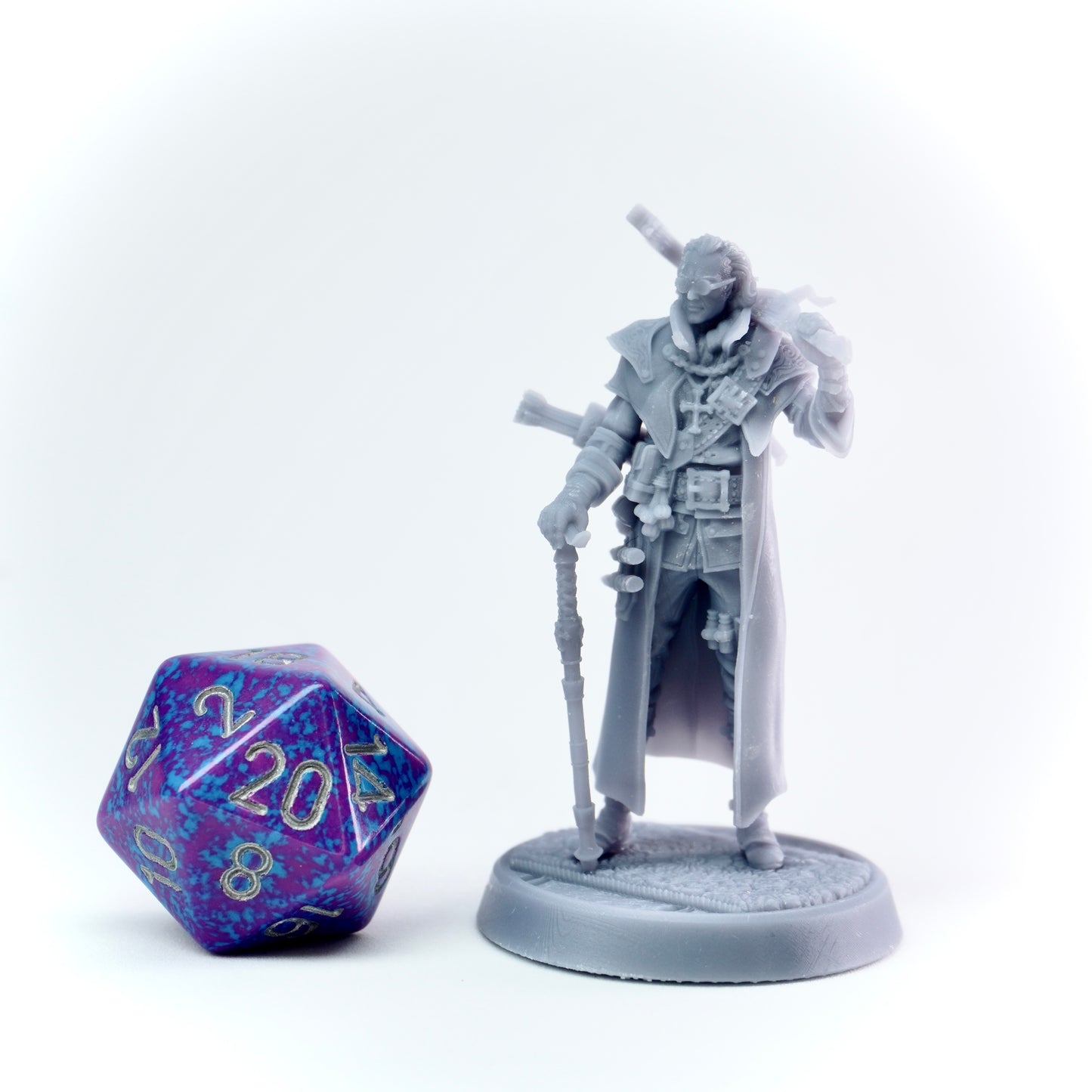 Gray fantasy figurine with a large polyhedral dice on a white background