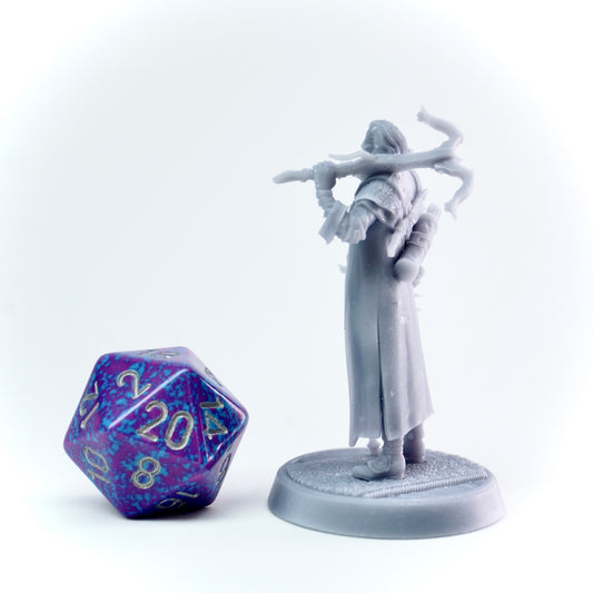 White fantasy figurine with a cane next to a polyhedral dice on a white background