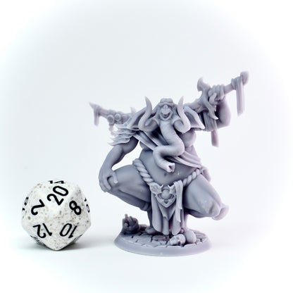 Gray fantasy figurine with a sword next to a polyhedral dice on a white background