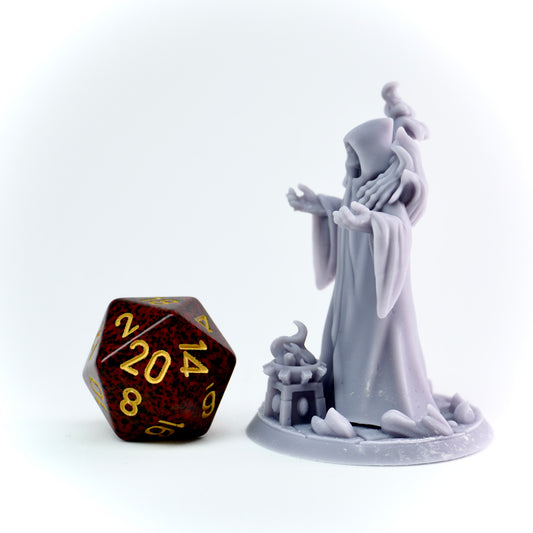 Gray figurine of a cultist next to a brown polyhedral dice on a white background