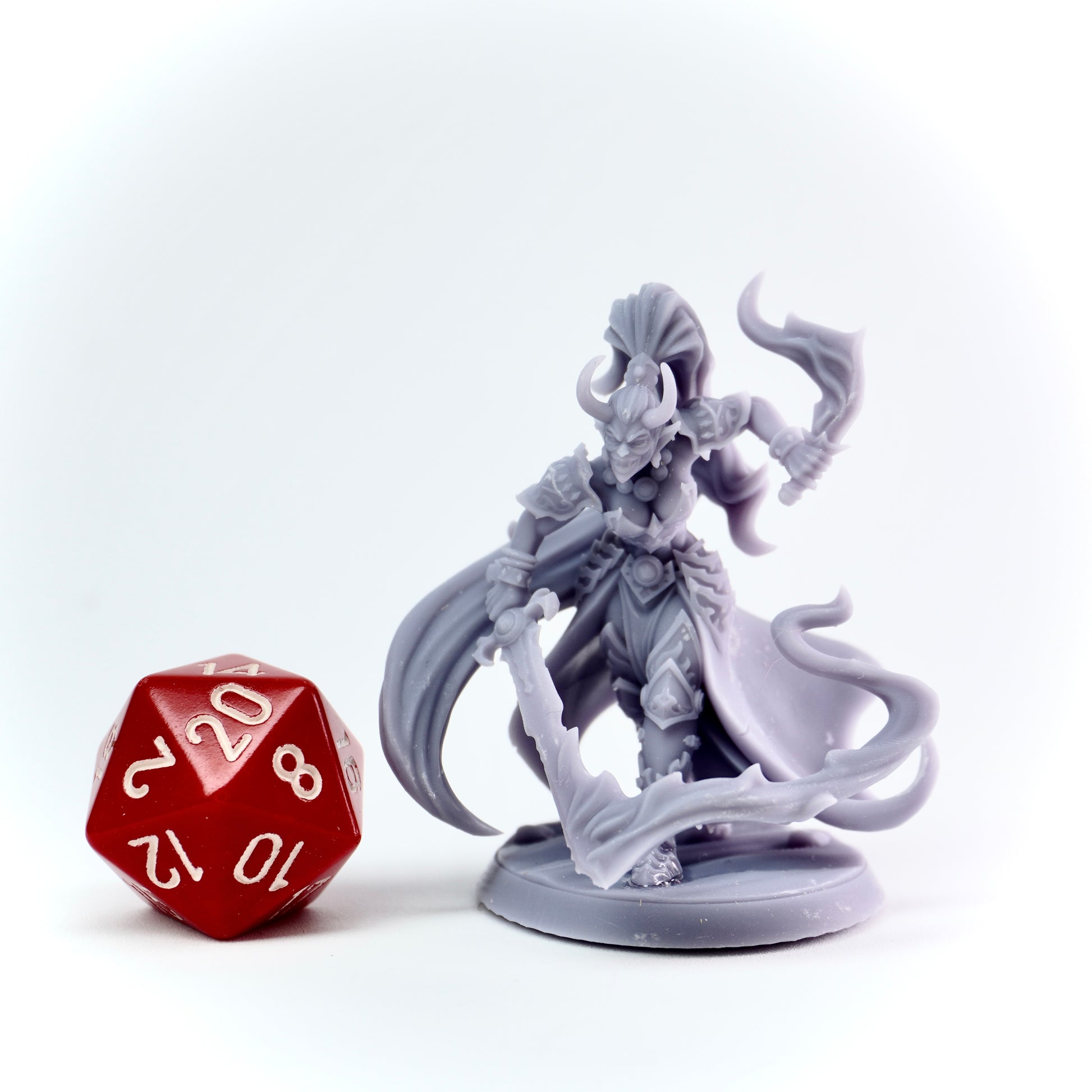 Gray fantasy figurine with a red and white die on a white background