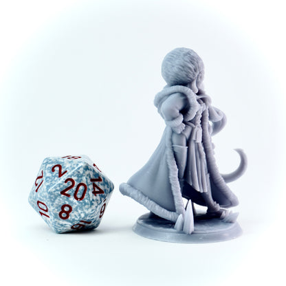Gray miniature figure of a female character with a large die on a white background