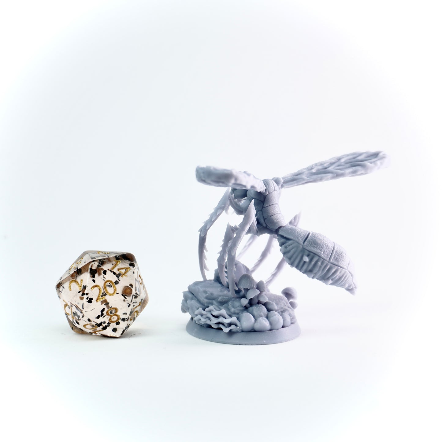 Decorative miniature with giant insect and on a white background