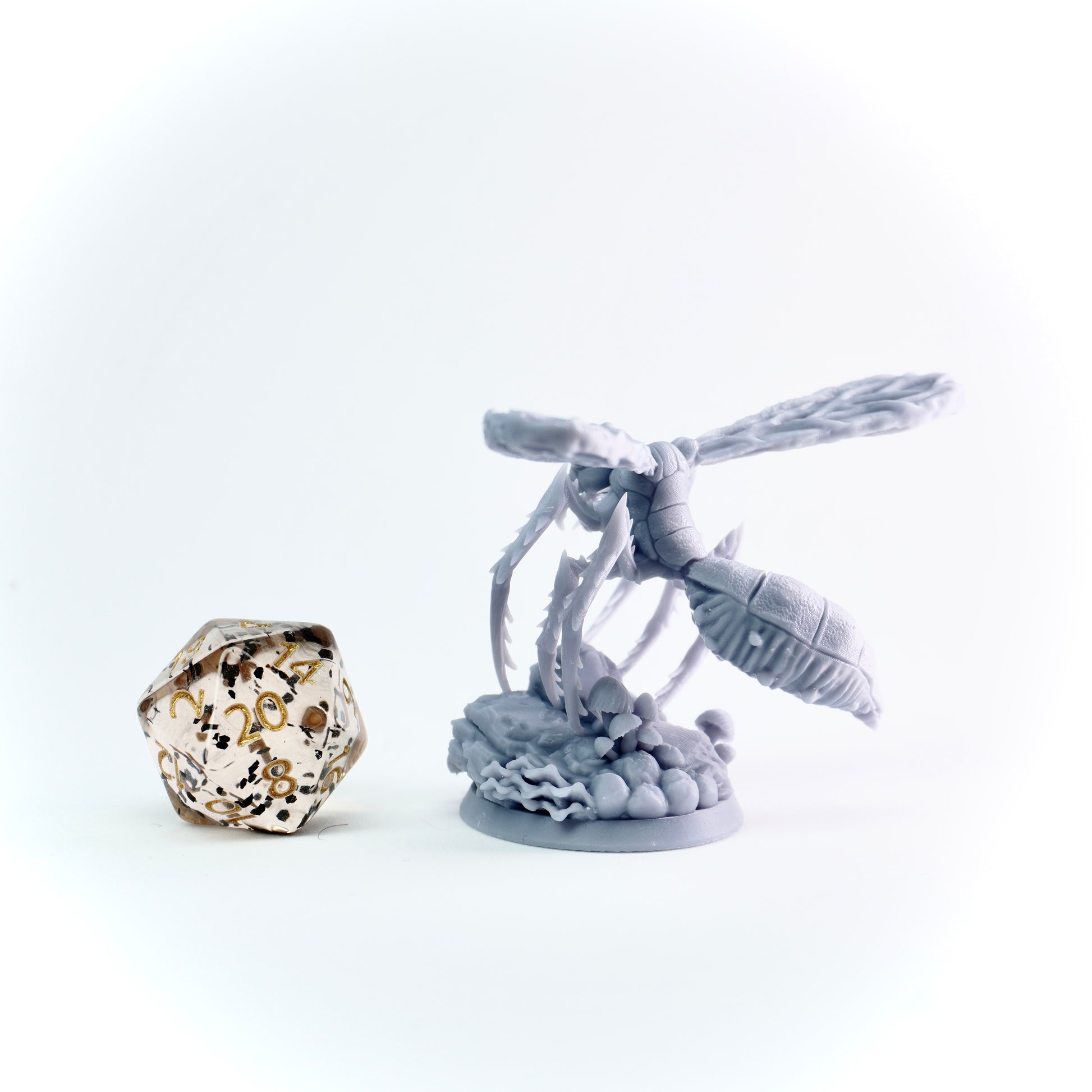 Decorative miniature with giant insect and on a white background