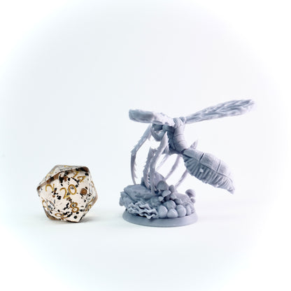 Decorative miniature with giant insect and on a white background