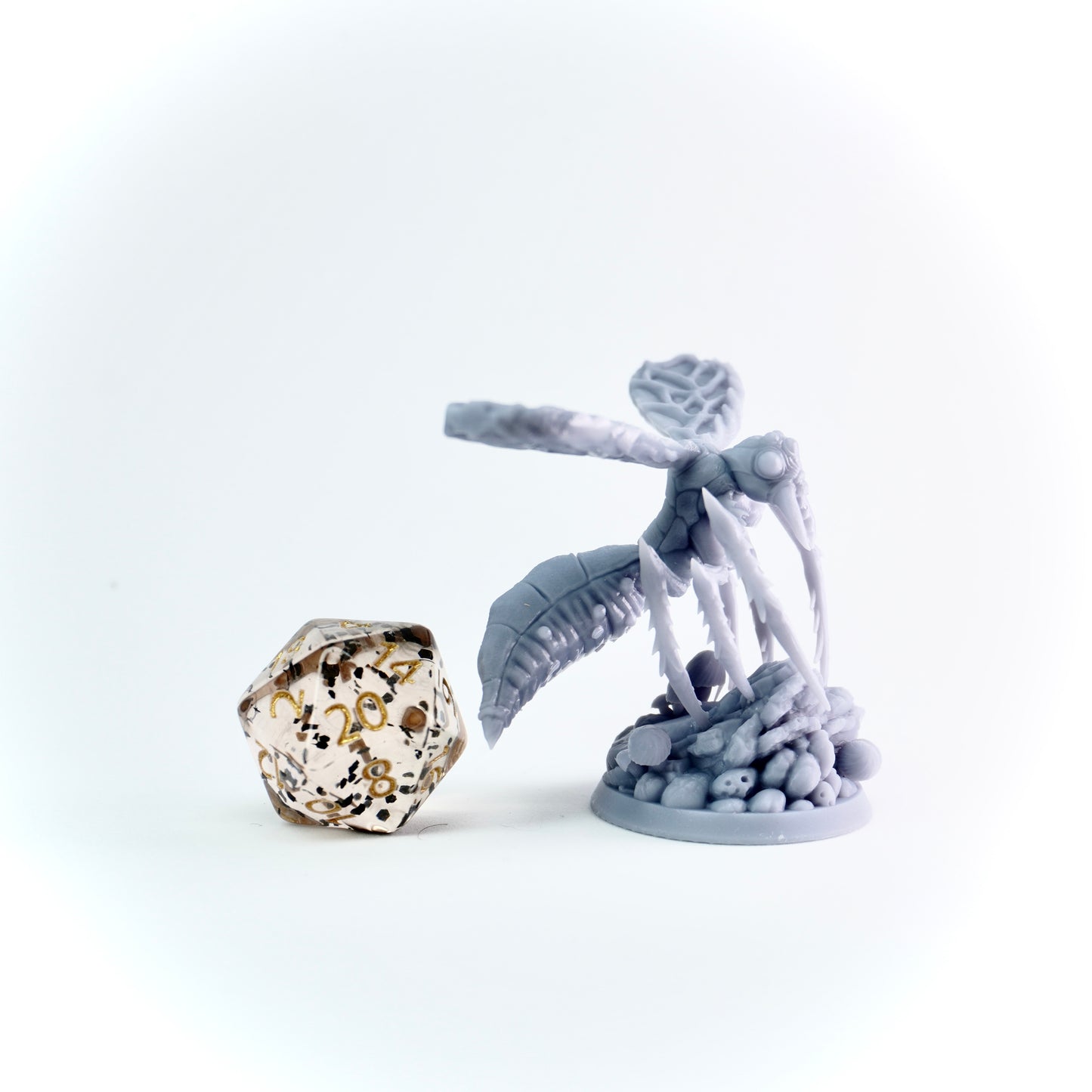 Gray insect figure with a large crystal on a white background