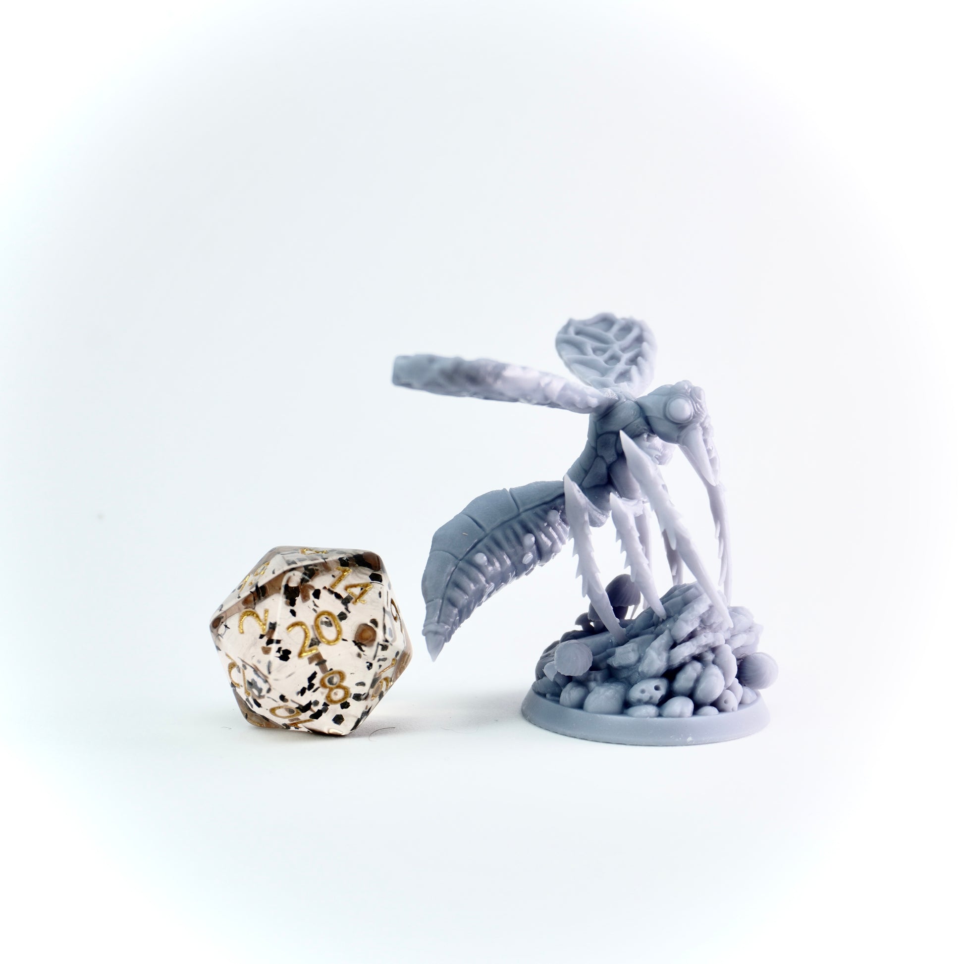 Gray insect figure with a large crystal on a white background