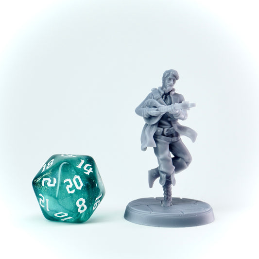 Gray miniature figure of a character holding a lute next to a green polyhedral dice on a white background