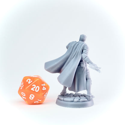 Gray fantasy figure with a large orange polyhedral dice on a white background