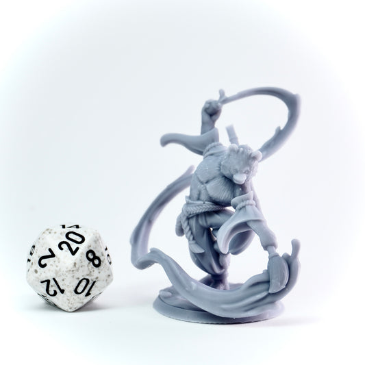 Gray fantasy figurine on a white background with a 20-sided die.