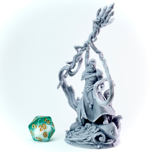 Gray greek god figurine of a warrior with water spell and a trident, accompanied by a green polyhedral dice.