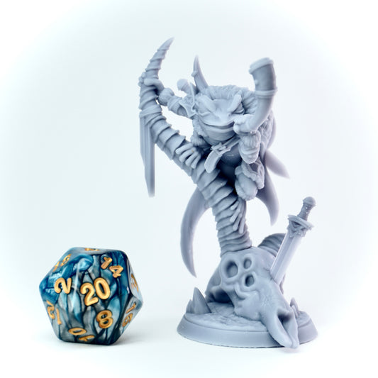 Gray fantasy figurine with a large weapon next to a 20-sided die on a white background