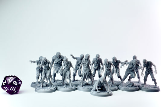 Gray zombie horde figurines with a purple dice on a white background