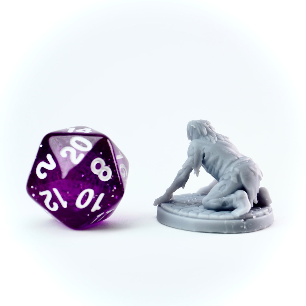 a gray zombie figurine on a white background